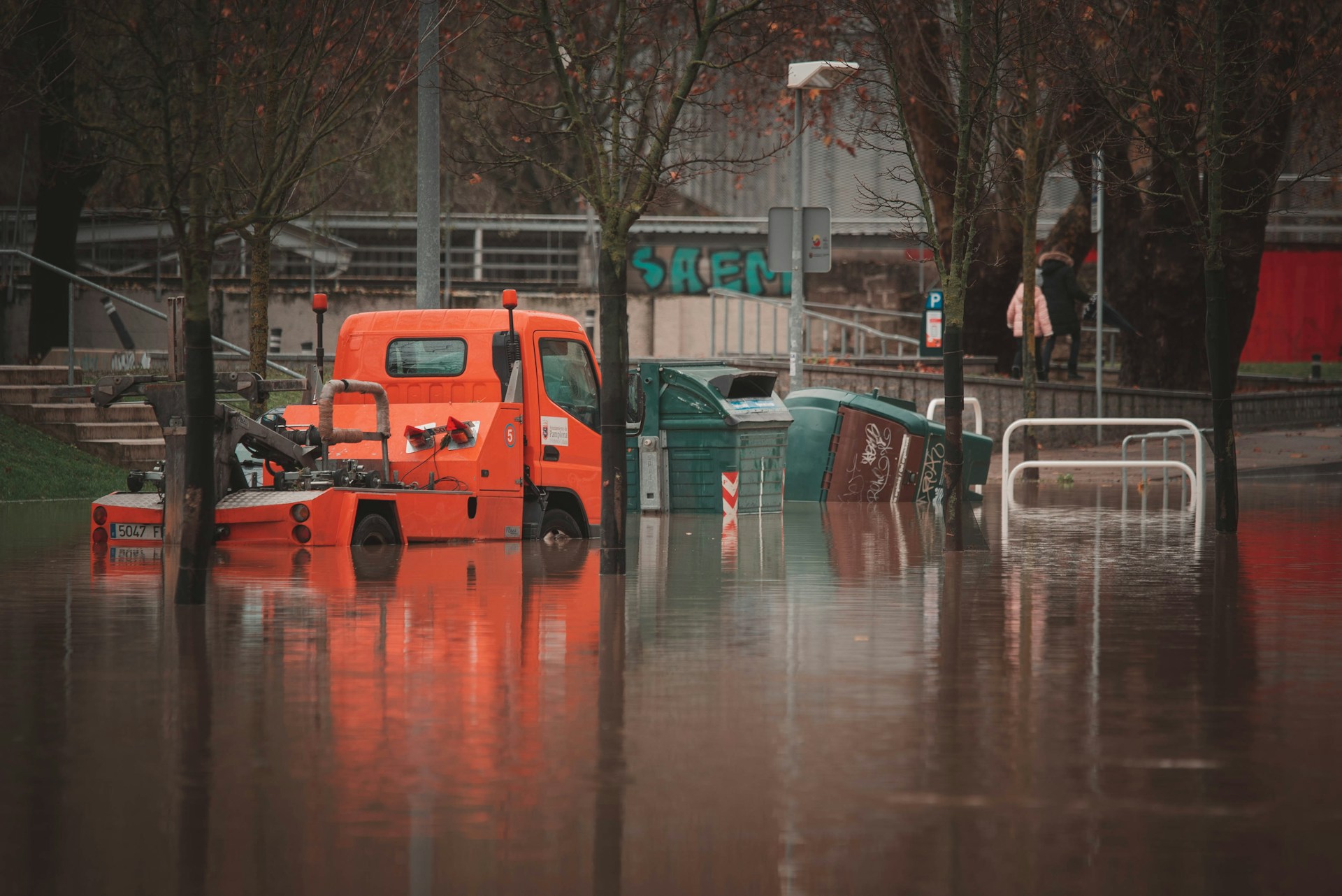 Orange Truck Stuck in Flooded Street