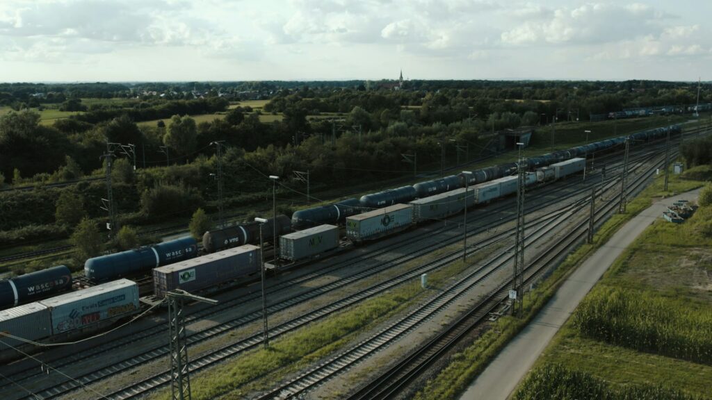 Arial view of freight trains with overhead cables for electric trains