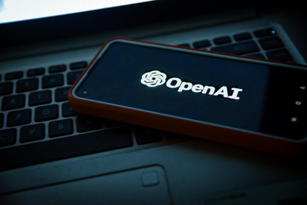 OpenAI app on a mobile phone and laptop