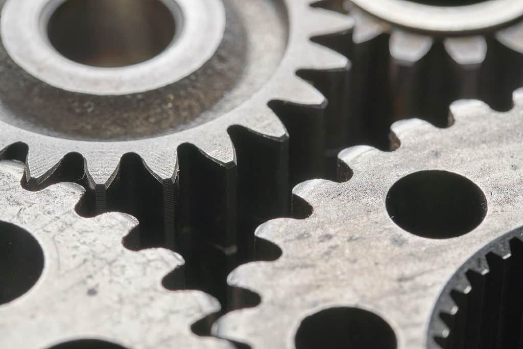 close up photo of 3d metal printed gears and components