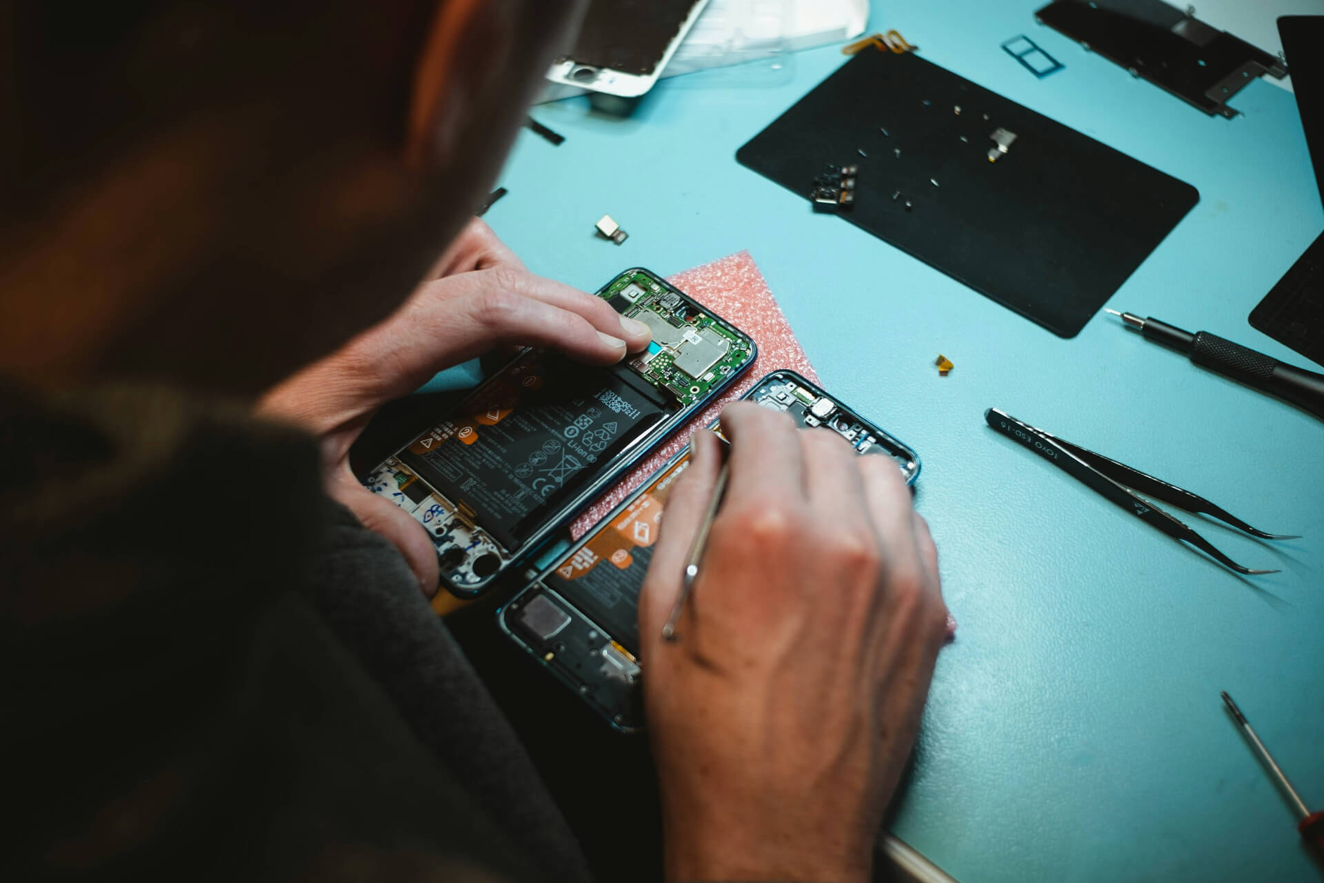 person repairing a phone