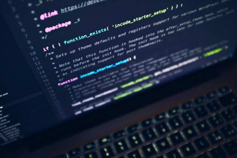 A laptop screen with lines of code