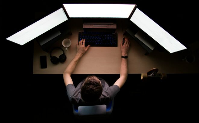 A man sitting at a computer.