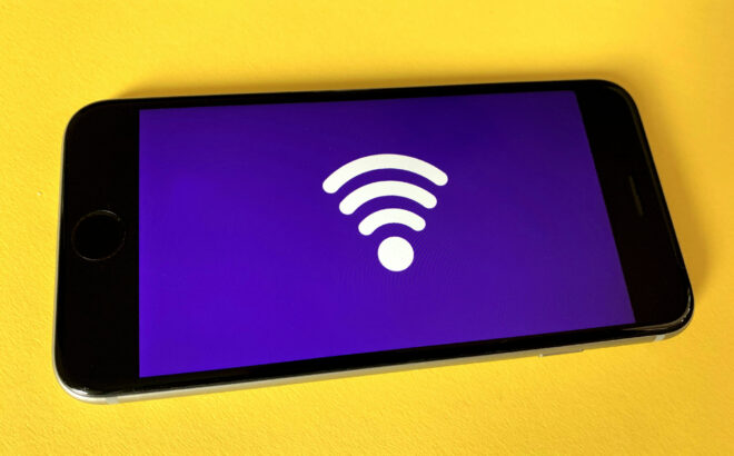 phone with wifi symbol on yellow background