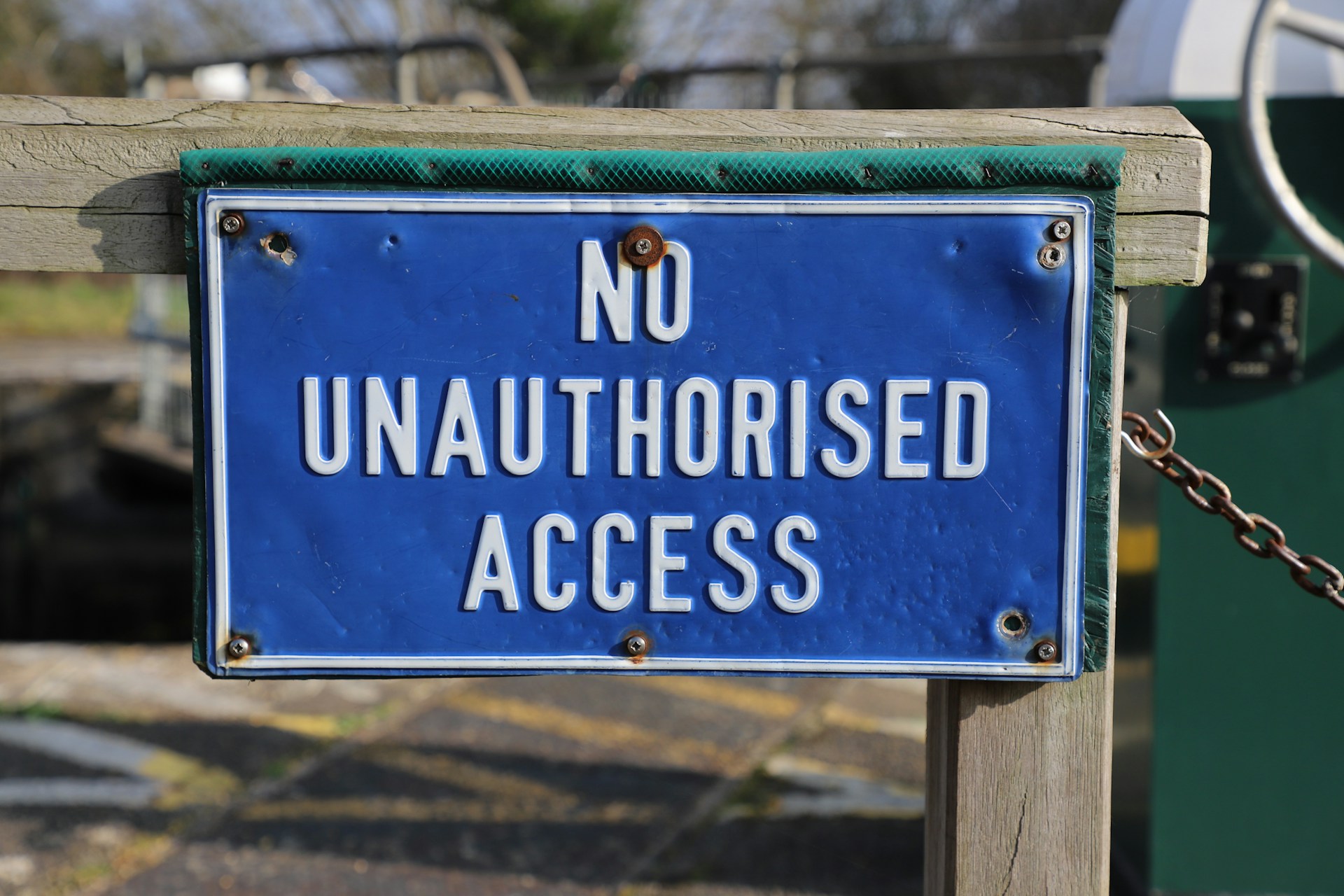 A blue sign saying "no unauthorized access"