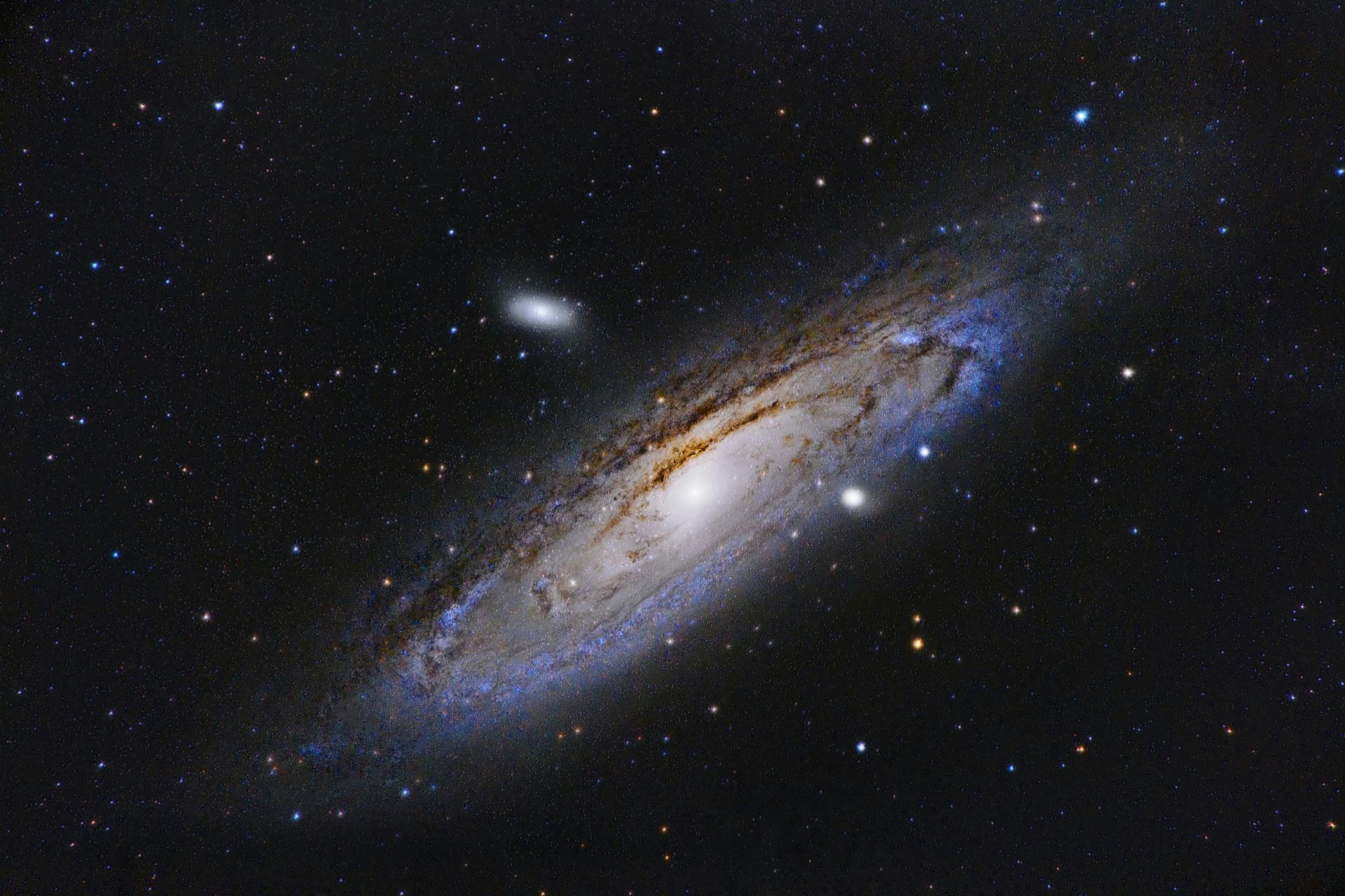 A spiral galaxy showing a bright core surrounded by blue and golden hues