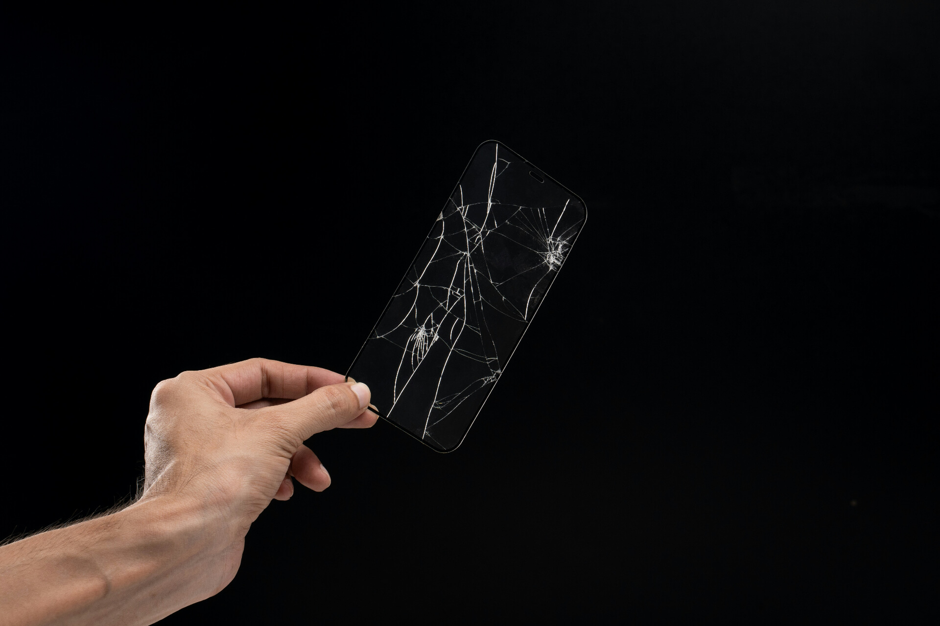 person holding broken phone