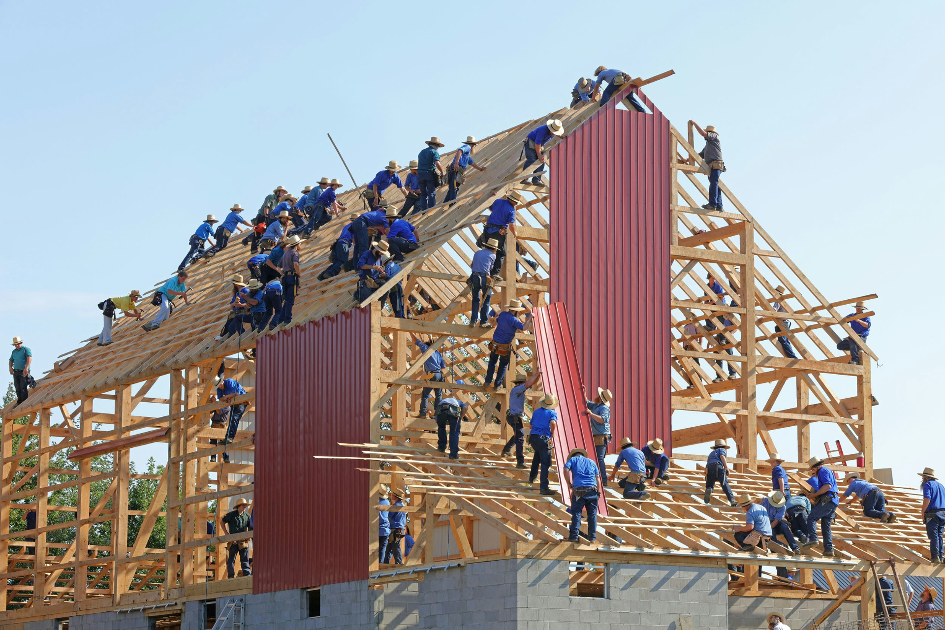 construction workers building a wooden building