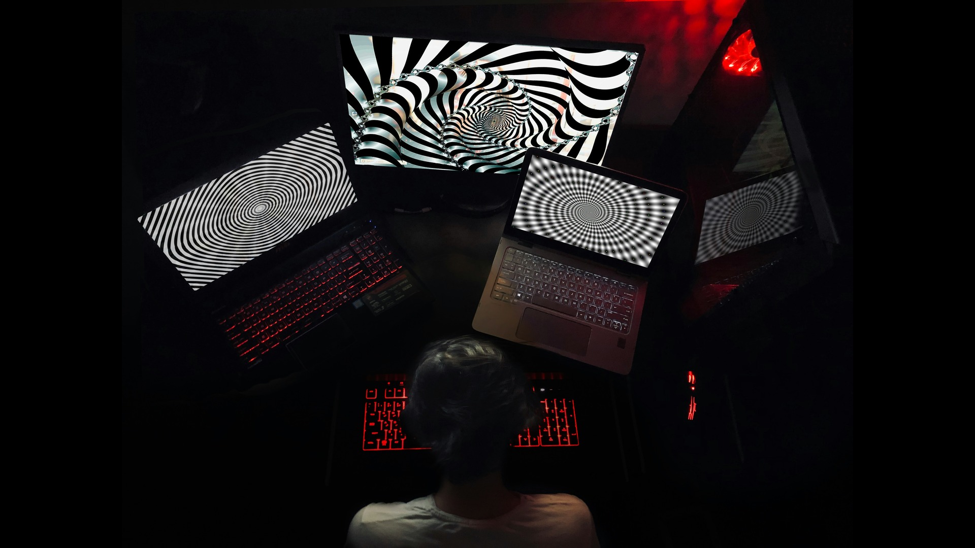 a person looking into three screens