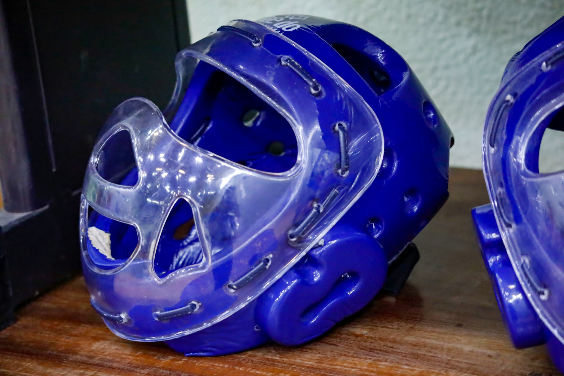 A baseball helmet sitting on a table top