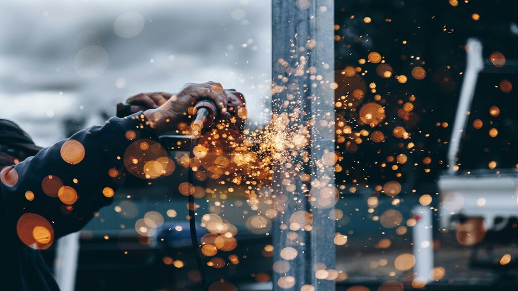 a man utilizing metal fabrication processes