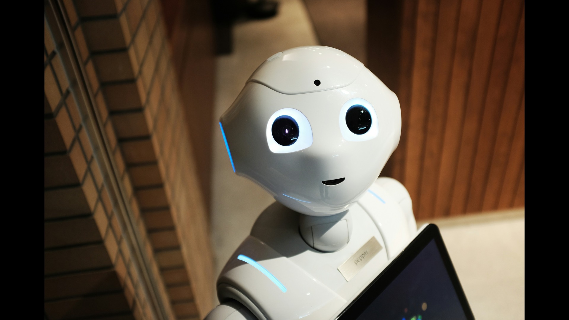 innocent looking white robot smiling